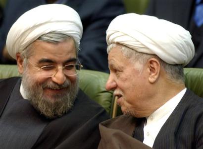 Former Iranian president Akbar Hashemi Rafsanjani, right, talks with Secretary of Supreme National Security Council and Iran (news - web sites)'s top nuclear negotiator, Hasan Rowhani, as they attend in closing ceremony of a two-day international conference on nuclear technologies and sustainable development in the Iranian capital, Tehran, Sunday March, 6, 2005. (AP Photo/Hasan Sarbakhshian) 