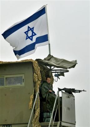 An Israeli soldier mans the main army checkpoint at the entrance of the West Bank town of Jericho Wednesday March 9, 2005. Israeli and Palestinian security commanders failed to reach agreement Wednesday on the handover of Jericho to Palestinian security control, participants said. [AP]