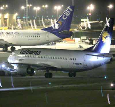 A Lufthansa aircraft gets towed away from a gate at Zaventem airport in Brussels March 11, 2005. Belgian police boarded a Lufthansa plane occupied by more than 50 Iranian monarchist protesters at Brussels airport early on Friday after hours of negotiations with foreign ministry officials, witnesses said. [Reuters]