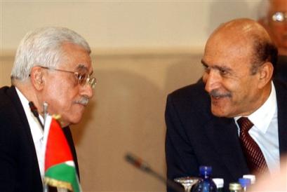 Palestinian leader Mahmoud Abbas , right, talks to Egypt's chief of intelligence Omar Suleiman before the opening session of the five-days of talks in Cairo Tuesday, March 15, 2005. Leaders of militant Palestinian factions gathered in Cairo for talks with Egyptian and Palestinian officials aimed at consolidating a fragile cease-fire . (AP Photo/Amr Nabil) 