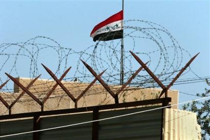 The flag of Iraq flies over the Jordanian embassy in Baghdad, Iraq Monday, March 21, 2005. Iraq and neighboring Jordan are engaged in a diplomatic spat, announcing a tit-for-tat withdrawal of high-level representatives Sunday in a growing dispute over Shiite Muslim claims that Jordan is failing to block terrorists from entering Iraq. [AP]