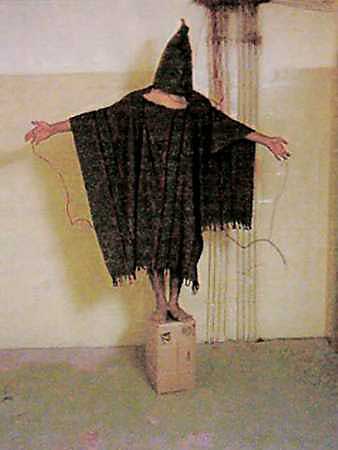 A hooded and wired Iraqi prisoner at Abu Ghraib prison is pictured in this undated photo. The United States has committed 'grave violations of human rights' against prisoners in Guantanamo Bay, Afghanistan and Iraq, the Foreign Affairs Committee of Britain's parliament said in a report on March 24, 2005. [Reuters/file]