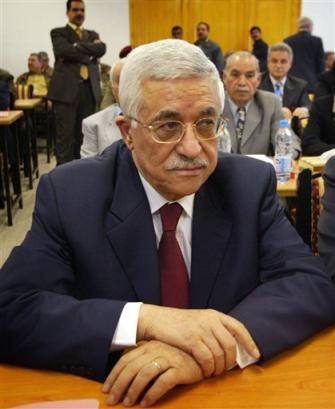 Palestinian Authority President Mahmoud Abbas, also known as Abu Mazen, waits for the beginning of a council meeting of his ruling Fatah party in Gaza City Sunday, March 27, 2005. [AP]