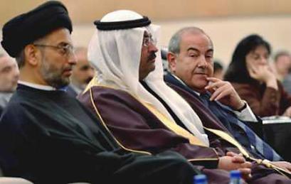 Iraq's Interim Prime Minister Iyad Allawi (R) sits next to President Ghazi al-Yawar (C) and Abdul Aziz al-Hakim, leader of the Islamic Revolution party as they attend the second session of the country's parliament, in Baghdad March 29, 2005. Iraq's parliament erupted in acrimony at only its second sitting on Tuesday and journalists were thrown out after lawmakers berated leaders for failing to agree on a new government, two months after historic elections. (Pool/Reuters) 