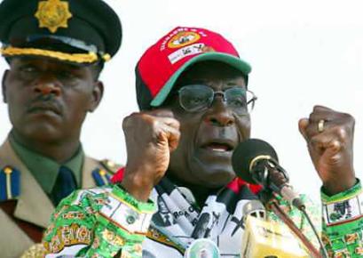 Zimbabwe President Robert Mugabe(R) addresses supporters at an election rally in a suburb of the capital Harare, March 30, 2005. Mugabe leads his ruling party into parliamentary elections on Thursday, facing a weakened opposition but also relentless international criticism that he has hijacked democracy. (Reuters) 