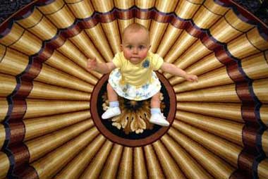 Madisen Geesaman, 10 months, of Reading, Pa., waits for her turn to audition in the Quiznos 'Go Hollywood, Baby!' casting call, Thursday, March 31, 2005, in New York. Casting calls took place in Miami, Los Angeles, Chicago as well as New York for a baby 4 to 18 months to head to Hollywood and land a 'crawl-on' role in an upcoming Quiznos commercial alongside screen legend Baby Bob in addition, the chosen baby will earn $30,000. (AP