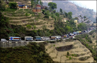 Nepalese buses and trucks stand idle on the Dhading highway west of Kathmandu on the second day of a nationwide strike called by rebels. A blockade paralysed the main entry point to Nepal's capital with hundreds of trucks and buses stranded awaiting security checks and armed escorts, a police source said. Troops and police were escorting truck and bus convoys to and from the capital to guard against attacks from the rebels. [AFP]