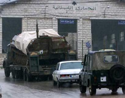 Syrian troops withdraw toward the Syrian border with Lebanon in al-Masnaa point in eastern Lebanon in Bekaa valley April 3, 2005. Syria will withdraw all its troops and intelligence agents from Lebanon by April 30, U.N. envoy Terje Roed-Larsen said on Sunday. (Afif Diab/Reuters) 