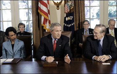 US President George W. Bush (C) speaks to reporters beside US Secretary of State Condoleezza Rice (L) and US Secretary of Defense Donald Rumsfeld (R) following a Cabinet meeting at the White House 05 April 2005 in Washington, DC. Six days before his scheduled meeting with Israeli Prime Minister Ariel Sharon, Bush said there should be 'no expansion' of Israeli settlements in Palestinian territories under the US-backed 'road-map' to Middle East peace.(AFP/Brendan Smialowski) 