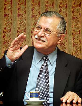 Jalal Talabani, leader of the Patriotic Union of Kurdistan, speaks with journalists during a press conference in Tehran in this October 31, 2002 file photo. Leaders of the main political blocs said veteran Kurdish politician Jalal Talabani would be named president at a parliament meeting on April 6, 2005, more than nine weeks after millions of Iraqis braved insurgent bombs to vote.