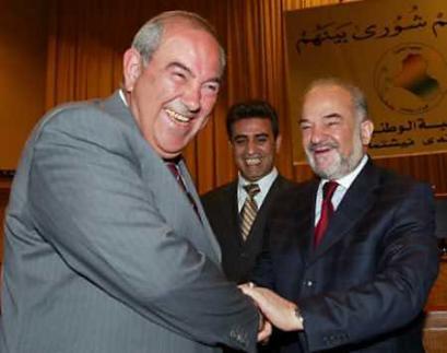 Outgoing Iraqi prime minister Iyad Allawi(L) greets incoming prime minister Ibrahim Jaafari(R) at a National Assembly meeting in Baghdad April 7, 2005. Jaafari announced his own nomination shortly after Iraq's new president, Kurdish former guerrilla leader Jalal Talabani, was sworn into office in parliament, along with two deputies. (Ceerwan Aziz/Reuters) 