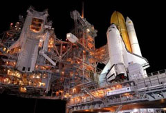 Shuttle begins slow creep to launch pad