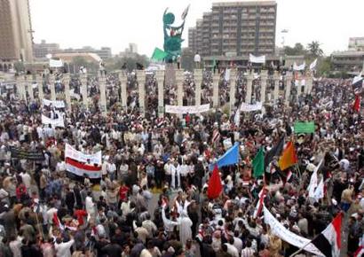 Thousands of Iraqi Shi'ites loyal to cleric Moqtada al-Sadr hold a demonstration in Baghdad's Firdos Square April 9, 2005 where a statue of former Iraqi president Saddam Hussein was pulled down by Iraqis and American soldiers two years ago. The rally was called on the second anniversary of the fall of Baghdad with protesters demanding an end to the U.S. military presence in Iraq and a speedy trial for former president Saddam Hussein. REUTERS/Ali Jasim