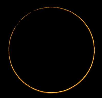 The moon passes between the earth and the sun to cause an annular eclipse as seen from in Venezuela's Andean village of Macigual in western state of Merida, 730 km from Caracas, April 8, 2005. This eclipse seen as complete only from a narrow corridor in Panama, Colombia and Venezuela, is a rare occurrence known as a hybrid eclipse, due to the fact that parts of the path are annular, leaving a ring of the sun visible around the moon, and other parts total. [Reuters]