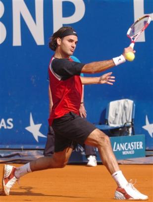 Roger Federer of Switzerland returns a backhand to Fernando Gonzalez of Chile during their third round match at the Monte Carlo Open Tennis tournament in Monaco, Thursday April 14, 2005. Federer won 6-2, 6-7 (3), 6-4. (AP Photo/Claude Paris)
