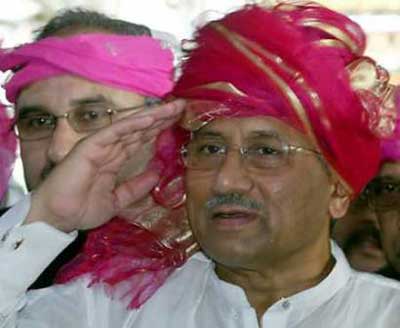Pakistan's President Pervez Musharraf (R) salutes to people at the shrine of Sufi saint Khwaja Moinuddin Chisti in Ajmer, 78 miles south from Rajasthan's capital state of Jaipur, April 16, 2005. Musharraf arrived in India on Saturday for a weekend of prayers, peace talks and cricket, his first visit since a disastrous summit in 2001 and a sign of warming ties between the nuclear rivals. 