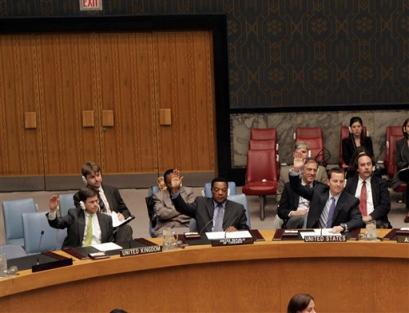 Members raise their hands as the United Nations' Security Council votes unanimously to widen the U.N. arms embargo in Congo as part of stepped-up efforts to bring peace to the country's volatile east Monday, April 18, 2005 at UN Headquarters in New York. (AP Photo/David Karp) 