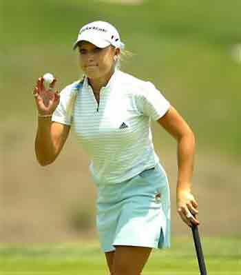 Natalie Gulbis, of the United States, acknowledges the gallery after finishing her round on the ninth hole during the first round of the LPGA Corona Morelia Championship Thursday, April 21, 2005, at the Tres Marias Residential Golf Club, in Morelia City, Mexico. Gulbis finished the day at 6-under par. (AP