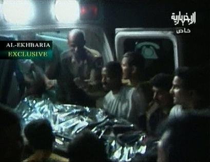 A body is placed in an ambulance in Mecca, Saudi Arabia, Thursday, April 21, 2005 after Islamic militants clashed with Saudi security forces in Islam's holiest city in a gunbattle that killed two militants and two policemen on a day Saudis were going to the polls in the latest round of municipal elections. The fighting in Mecca started when four militants in a car _ a driver and three others disguised in women's all-covering robes _ tried to cross through a checkpoint into the city several hours after polls closed, said Brig. Gen. Mansour al-Turki, an Interior Ministry spokesman. (AP