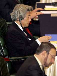 Japanese Prime Minister Junichiro Koizumi (L) attends the opening of the Asian-African leaders Summit in Jakarta April 22, 2005. Koizumi apologised on April 22 for the 'tremendous damage and suffering' caused by Japan's wartime past in an apparent effort to help douse a flaming row with China. Koizumi made the apology during a speech at a multilateral summit in Jakarta in front of leaders from 100 Asian and African countries including Chinese President Hu Jintao, whom he is likely to meet in the coming days. [Reuters]