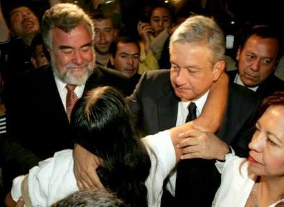 Mexico City Mayor Andres Manuel Lopez Obrador (center right) embraces a supporter as he arrives at a news conference, April 25, 2005. Mexico City's popular leftist mayor, caught in a legal wrangle that could end his presidential ambitions, returned today in open defiance of the federal government, which wants to put him on trial. Obrador, the front-runner to win the July 2006 presidential polls, had not been to his office since Congress stripped his immunity from prosecution earlier this month so he could face charges of contempt of court. REUTERS
