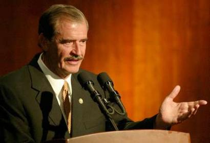 Mexican President Vicente Fox speaks at a conference on micro credits at the Mexican foreign ministry, April 25, 2005. Fox's spokesman today said impeached Mexico City mayor Andres Manuel Lopez Obrador is breaking the law by returning to his job this morning . REUTERS