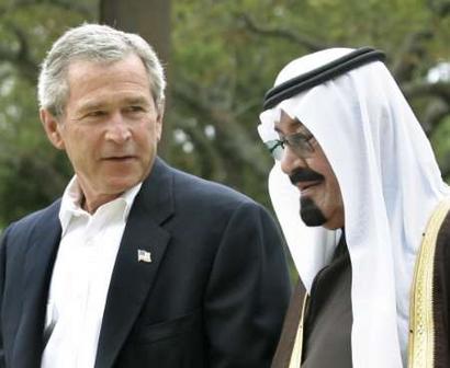 U.S. President George W. Bush walks with Saudi Arabia's Crown Prince Abdullah (R) on his ranch in Crawford, Texas, April 25, 2005. During his meeting with Crown Prince Abdullah, President Bush is expected to praise the kingdom's efforts to fight terrorism and seek its help in countering the economic threat posed by record oil prices. REUTERS