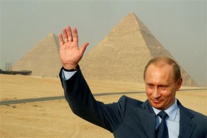 Russian President Vladimir Putin waves as he visits the hisorical site of Giza Pyramids near Cairo Wednesday, April 27, 2005. Putin, who become the first Russian or Soviet leader in 40 years to make an official state visit to Egypt, talks with Mubarak on bilateral relations and efforts to revive the tenuous peace process between Israel and the Palestinians. (AP