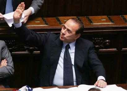 Italian Premier SIlvio Berlusconi gestures in the lower chamber in Rome,Wednesday, April 27, 2005.