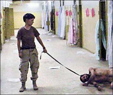 An undated photo obtained in May 2004 from the Washington Post shows US private Lynndie England holding a leash that appears to be around the neck of an Iraqi prisoner at Abu Ghraib Prison, outside Baghdad. England was expected to plead guilty to several charges at a court-martial.(AFP