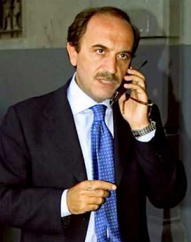 Italian intelligence officer Nicola Calipari, who died in a hail of bullets at a U.S. checkpoint on March 4 as he was driving to Baghdad airport with Italian journalist Giuliana Sgrena after winning her release from kidnappers, speaks on a mobile phone in this undated file photograph. (Reuters)