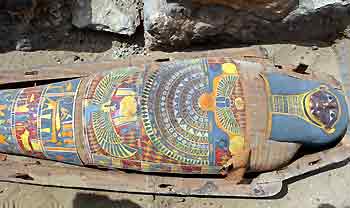 A 2,300-year old mummy is displayed after it was found by the Sakkara pyramids south of Cairo, May 3, 2005. Egyptian antiquities officials say the mummy is possibly the "most beautiful" found so far. They believe more mummies may be found in the same area. [Reuters]