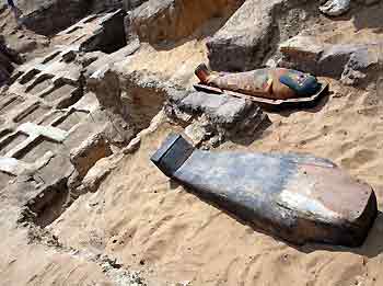 A 2,300-year old mummy is displayed after it was found by the Sakkara pyramids south of Cairo, May 3, 2005. Egyptian antiquities officials say the mummy is possibly the "most beautiful" found so far. They believe more mummies may be found in the same area. [Reuters]