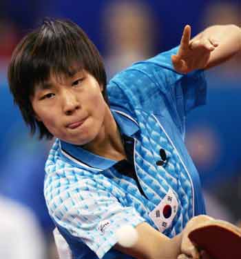Moon Hyun-jung of South Korea returns the ball during her third round singles match against Wang Nan of China at the 48th World Table Tennis Championship in Shanghai, China May 3, 2005.