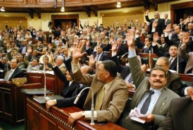 Members Egypts parliament vote with a show of hands during their ...