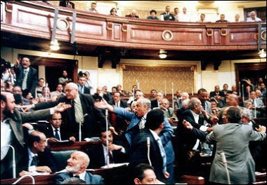 Egypt's parliament members shout as they discuss a controversial constitutional amendment which changes the rules of presidential elections from simple referendum system of 'yes' or 'no' vote to mutli-candidate elections.(AFP