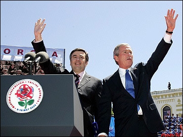 US President George W. Bush (R) and Georgian President Mikhail Saakashvili wave to a crowd in Tbilisi. A possible hand grenade was reportedly thrown toward a stage in Georgia where Bush was giving a speech, but the device was taken away by a Georgian security officer, the US Secret Service said(AFP