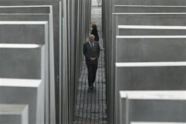 An unidentified participant of the opening ceremony visits Germany's newly opened Holocaust memorial in Berlin, Tuesday, May 10, 2005. (AP