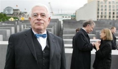 U.S. architect Peter Eisenman, left, visits Germany's newly opened Holocaust Memorial he designed in Berlin, Tuesday, May 10, 2005. In background left is Germany's parliament, the Reichstag. At right talks German President Horst Koehler with Holocaust survivor Sabina van der Linden, right. (AP