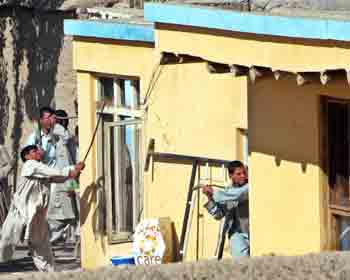 Afghan protestors smash windows of a buliding belonging to the Care aid group, an international organization, in Logar province, about 40 km (25 miles) southwest of Kabul May 12, 2005. [Reuters]