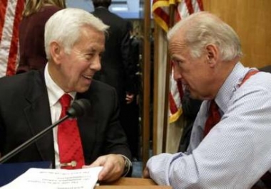 Chairman Sen. Richard Lugar (R-IN) (L) smiles to Sen. Joseph Biden (D-DE) after the Senate Foreign Relations Committee hearing on UN ambassador nominee John Bolton on Capitol Hill in Washington, May 12, 2005. REUTERS
