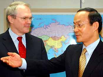 U.S. Assistant Secretary of State for East Asian and Pacific Affairs Christopher Hill (L) is greeted by Song Min-soon, South Korea's deputy foreign minister and a chief South Korean negotiator on the nuclear dispute, during their meeting at the Foreign Ministry in Seoul May 16, 2005. South Korean FM Ban Ki-moon and Hill expressed hope the North-South talks in the city of Kaesong in North Korea would provide an opportunity to tell Pyongyang it was in its interest to resume nuclear dialogue -- also stalled for nearly a year. [Reuters]
