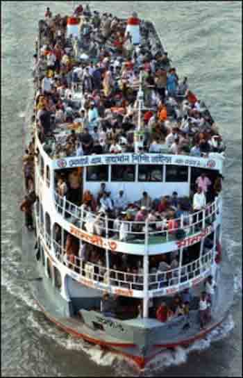 An overcrowded Bangladeshi ferry. Bangladesh authorities said they feared at least 100 people drowned after a ferry capsized in a remote southern area as strong currents and heavy winds hampered efforts to locate the sunken ship.(AFP/File
