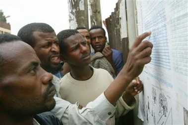 Voters look at a list of provisional results, Monday, May 16, 2005 at a polling station in the Ethiopian capital, Addis Ababa,after Sunday's third election in Ethiopia's 3,000-year history. After a stunning turnout of 90 percent that indicated voters were optimistic Ethiopia was headed toward greater democracy, officials were counting ballots in the parliamentary race Monday. (AP