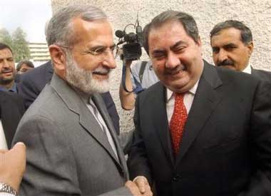 Iranian foreign minister Kamal Kharrazi, left, meets with Iraqi Foreign Minister Hoshyar Zebari at the Foreign Ministry in Baghdad, Iraq Tuesday, May 17, 2005. The meeting marked the highest-level visit by an official from Iran to its Mideast neighbor since Saddam Hussein's ouster. (AP