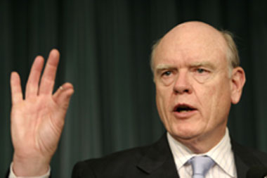 U.S. Treasury Secretary John Snow gestures during a news conference at the U.S. Treasury Department in Washington May 17, 2005. Secretary Snow released the Foreign Exchange Report during the event. 