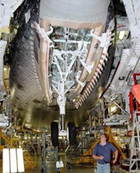 In this 
 photo 
 released by NASA a worker checks the recycling of space shuttle Atlantis' landing gear May 16, 2005 at Kennedy Space Center in Cape Canaveral, Fla. 