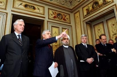 From left, French Foreign Minister Michel Barnier, Britain's Foreign Secretary Jack Straw, Iran's top nuclear negotiator Hassan Rowhani, German Foreign Minister Joschka Fischer and EU foreign policy chief Javier Solana attend a news conference at the British Residence in Brussels, in this Dec. 13, 2004 file photo. 
