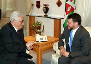 Jordan's King Abdullah (R) chats with Palestinian President Mahmoud Abbas at the Royal Palace in Amman May 24, 2005. Abbas said on May 24th he would ask U.S. President George W. Bush at White House talks this week to 'stick seriously' to a Middle East peace plan and avoid promises to Israel over the outcome of negotiations. (Reuters