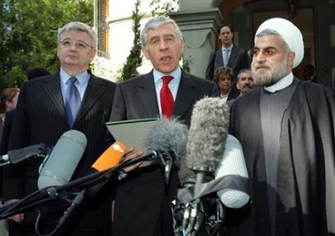 From left to right, German Foreign Minister Joschka Fischer, Britain's Foreign Secretary Jack Straw and Iran's top nuclear negotiator Hassan Rowhani, attend a press briefing after the nuclear talks between three European Union countries and Iran, in Geneva, Switzerland, Wednesday, May 25, 2005. Foreign ministers from France, Britain and Germany meet Iranian officials in Geneva for crucial talks aimed at avoiding an escalation of Tehran's standoff with the West on its nuclear program after Iran warned there was a high risk of deadlock. (AP 